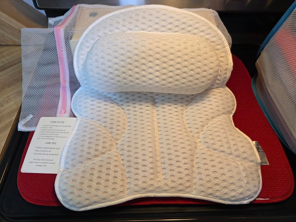 Front view of bath pillow on test bench with laundry bag