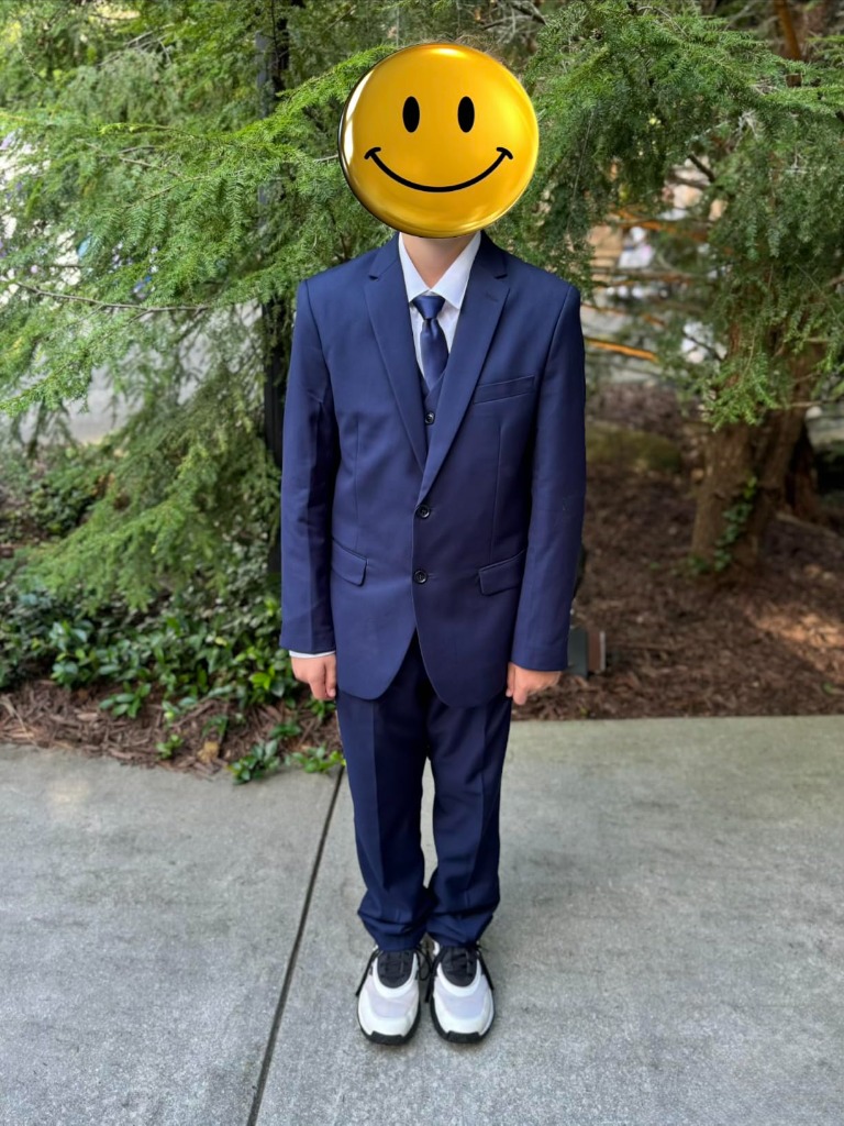 Full standing silhouette of the boys navy formal suit