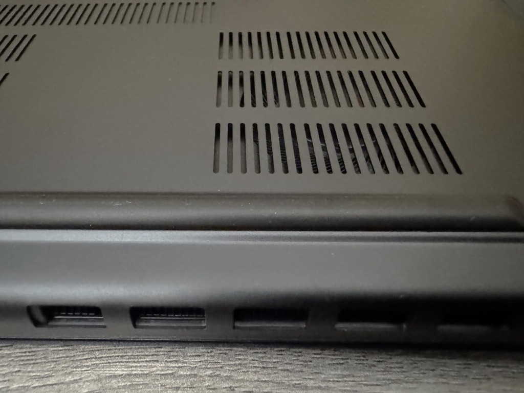 dynabook Portégé X40-M chassis side view showing Thunderbolt 4 ports and cooling exhaust