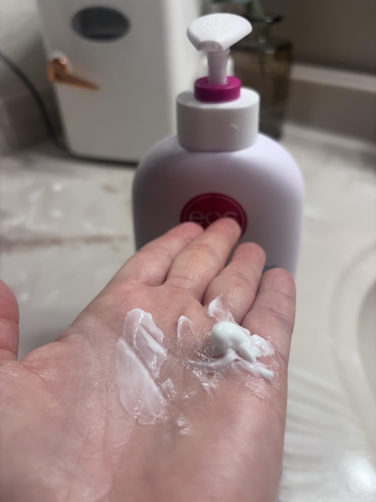 Rich velvety cream texture of eos Pumpkin Chai Body Lotion demonstrated on hand