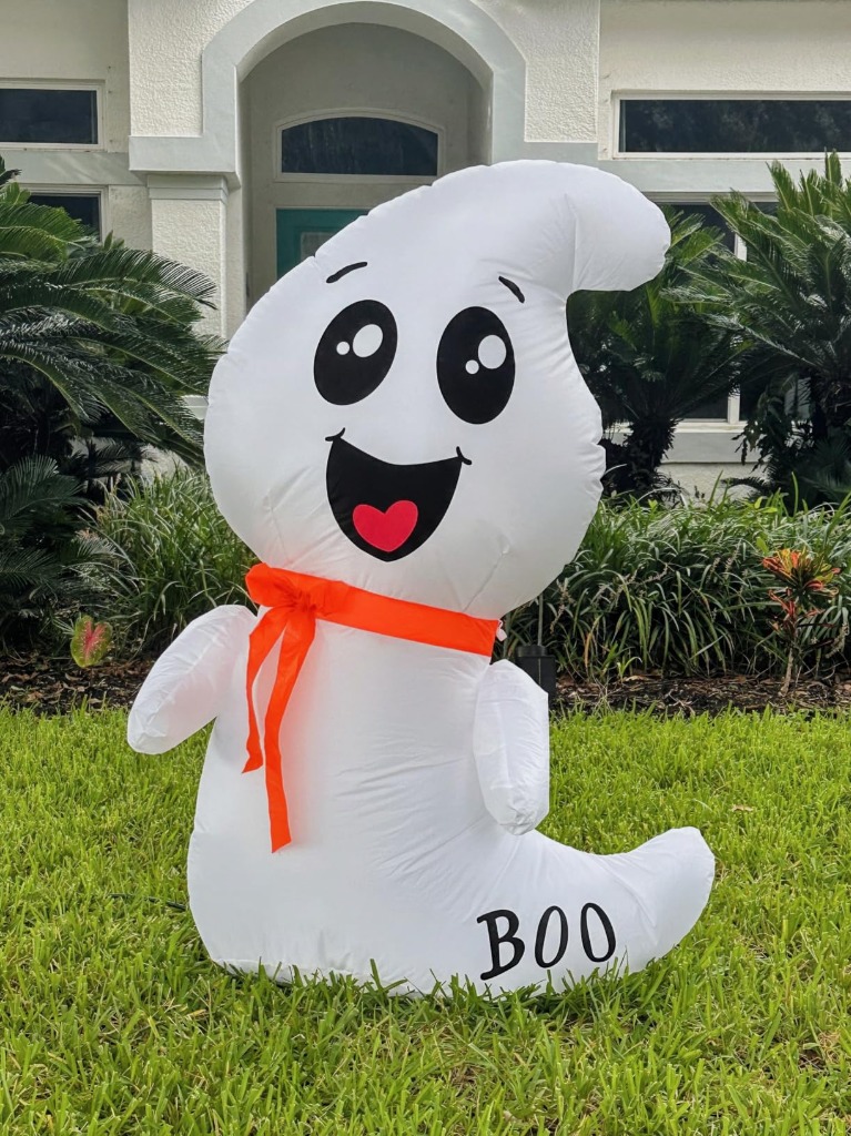 GOOSH 4 FT ghost inflated on front lawn in daytime
