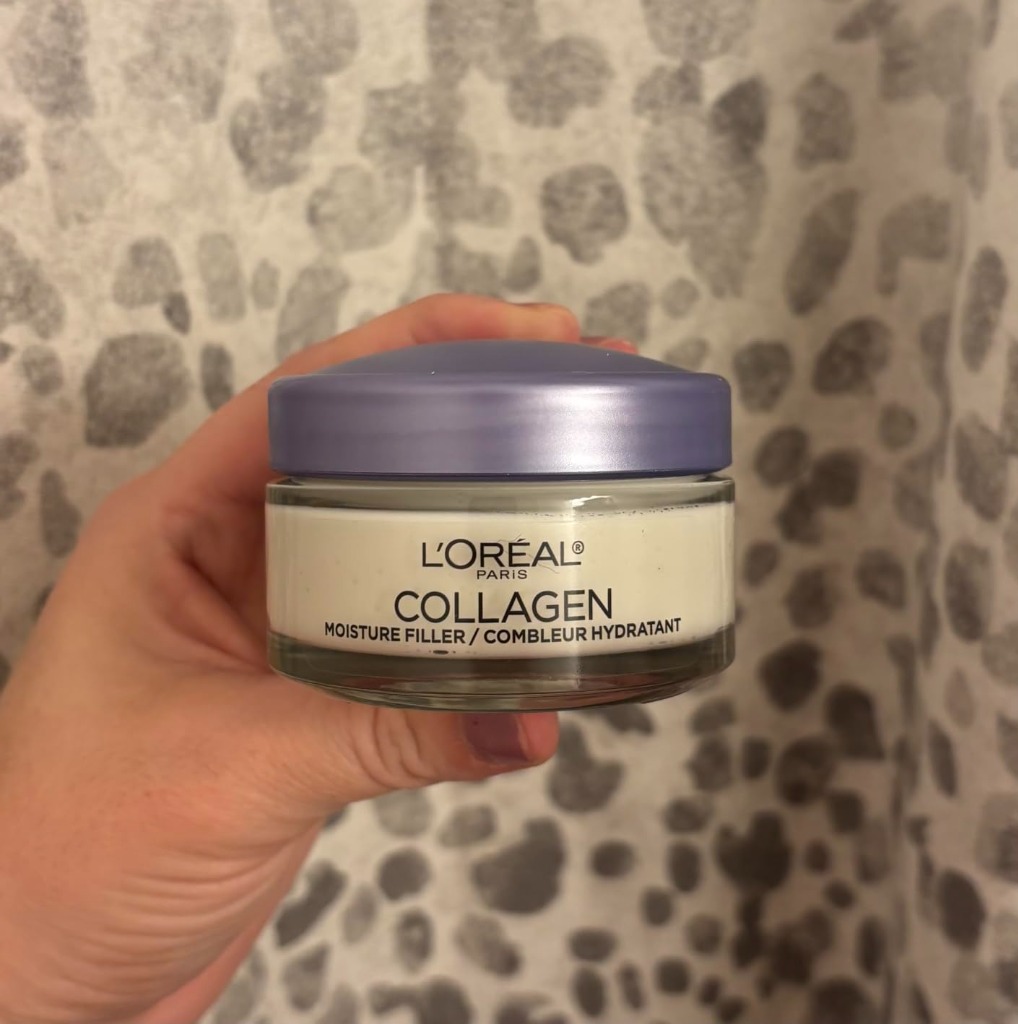 Customer holding L'Oreal Paris Collagen Moisture Filler jar in hand