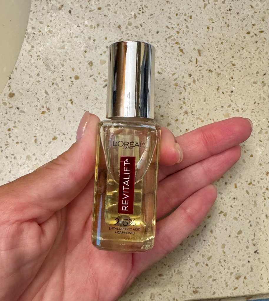 L'Oreal Revitalift Eye Serum Glass Bottle in Hand