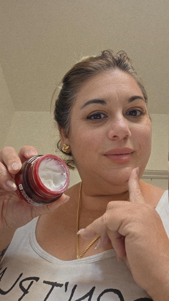 Tester Holding Open Olay Regenerist Jar Showing Whipped Texture