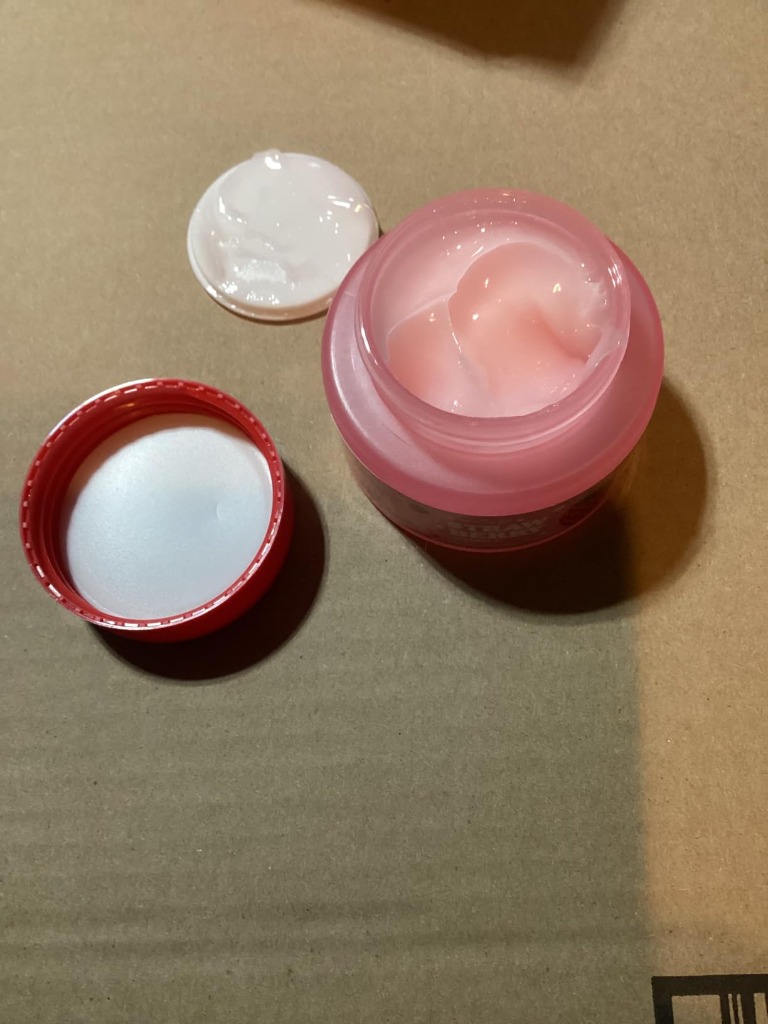 Open jar of SADOER Strawberry Face Cream showing smooth pink jelly cream texture