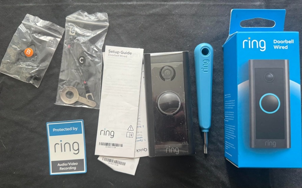 Ring Video Doorbell Wired unboxed with packaging, screwdriver and user guide