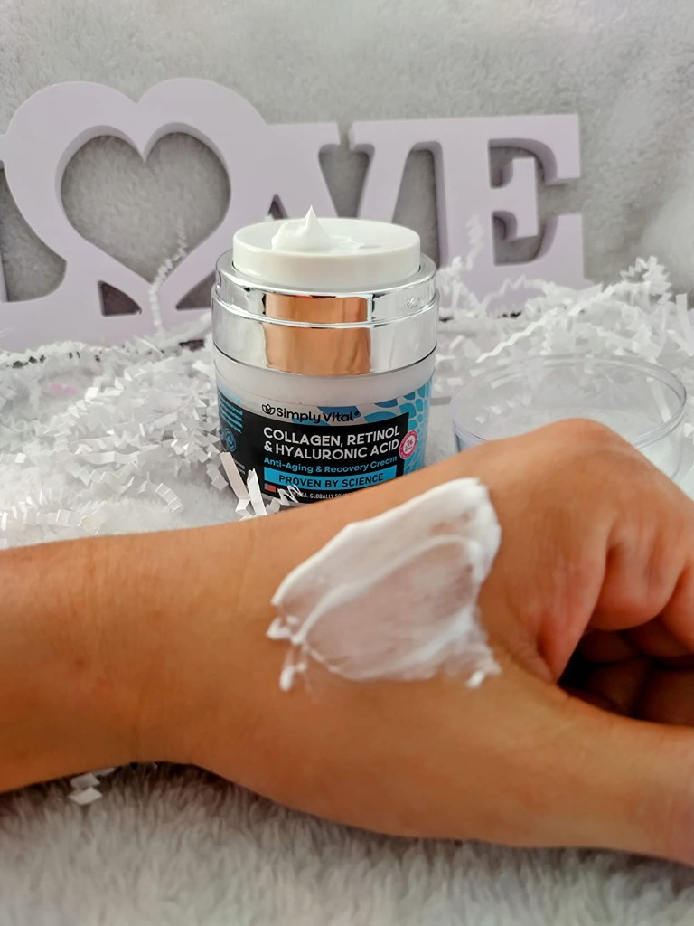 Hands-on swatch of SimplyVital cream showing rich white texture and push jar dispenser
