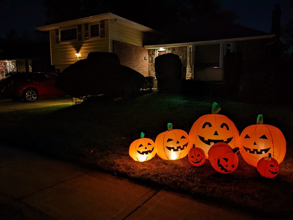 Front yard curbside view of the 7-pumpkin inflatable patch