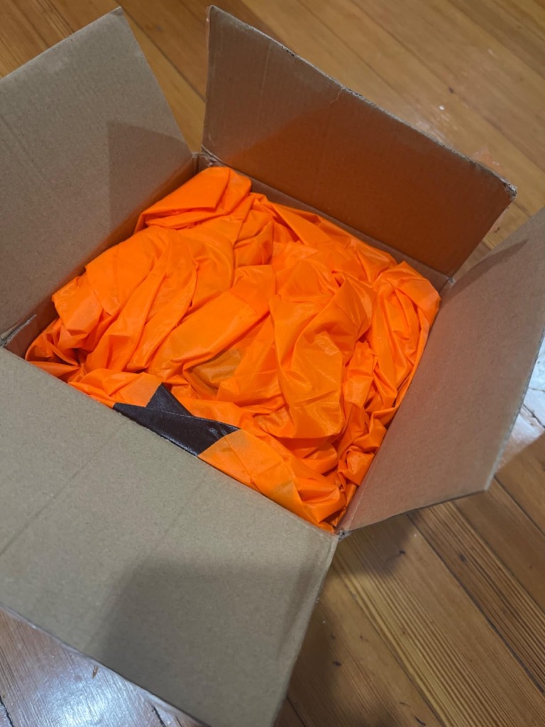 Tangkula pumpkin patch deflated and folded compactly inside shipping carton