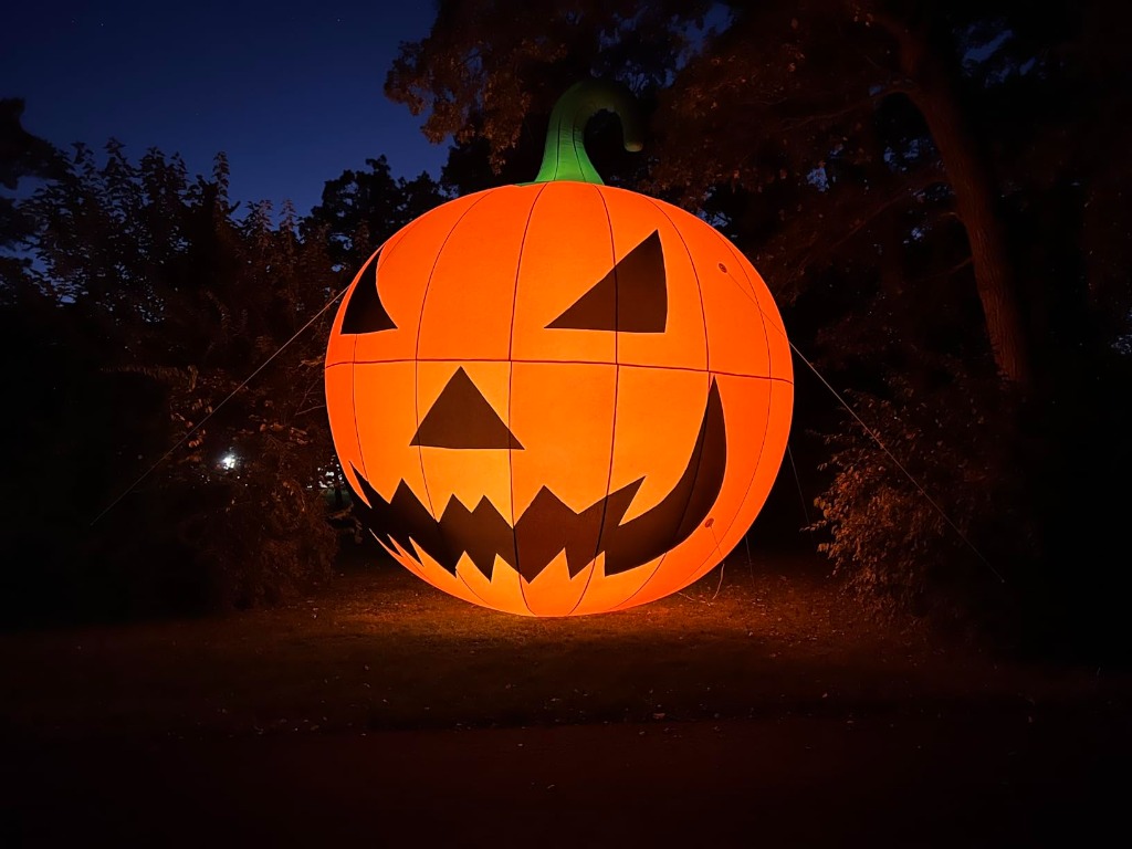 TKLoop Giant Pumpkin glowing intensely orange at night
